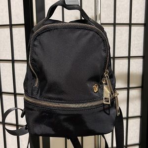 Lululemon Gold Edition zippers Black Mini Adventurer Backpack.